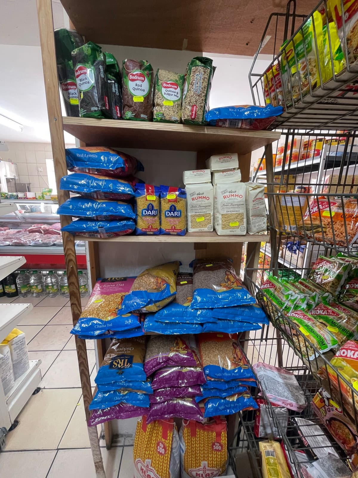 Bagged beans, lentils and pulses on shelving