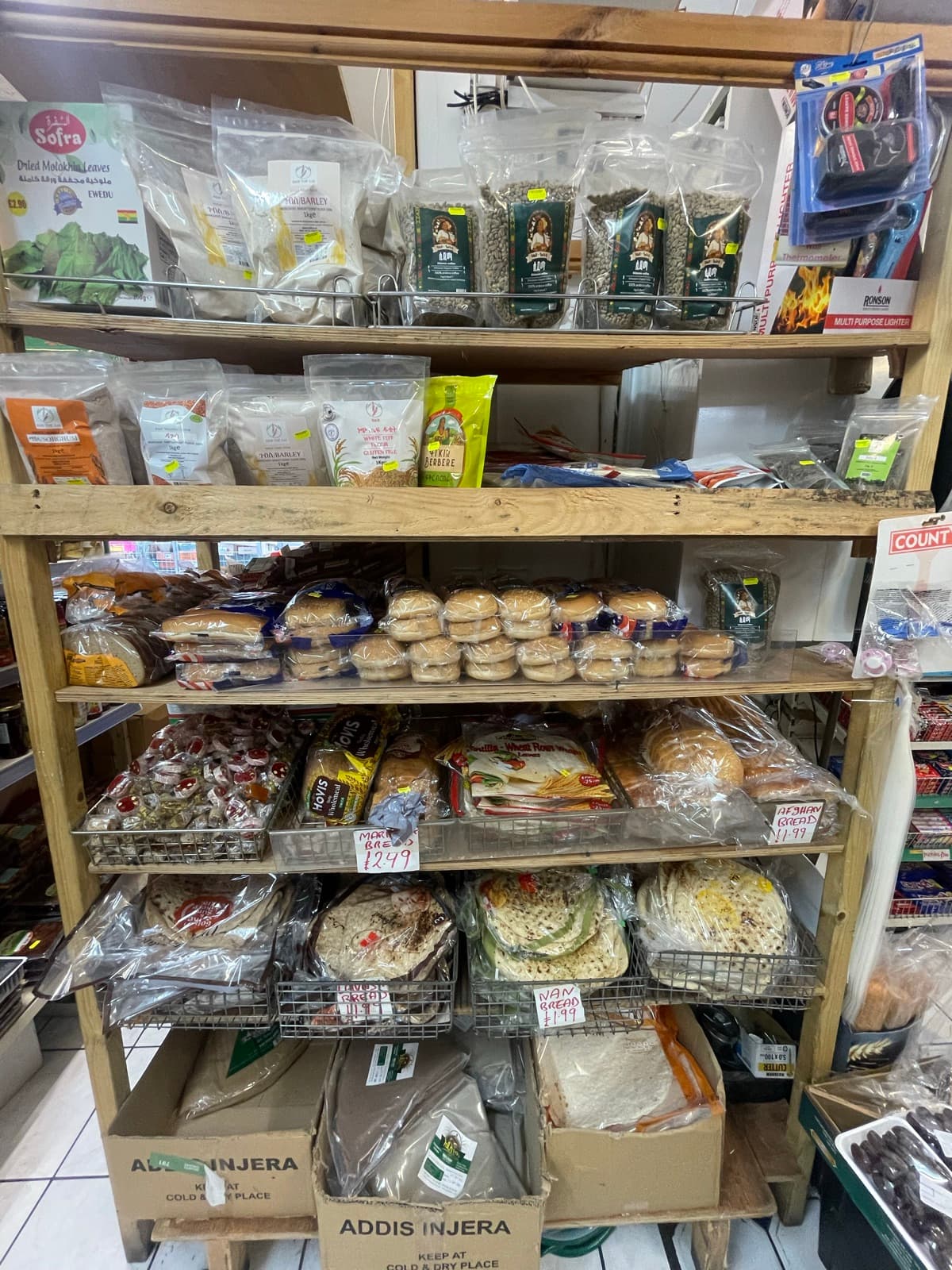 Shelving holding flatbreads and khubz