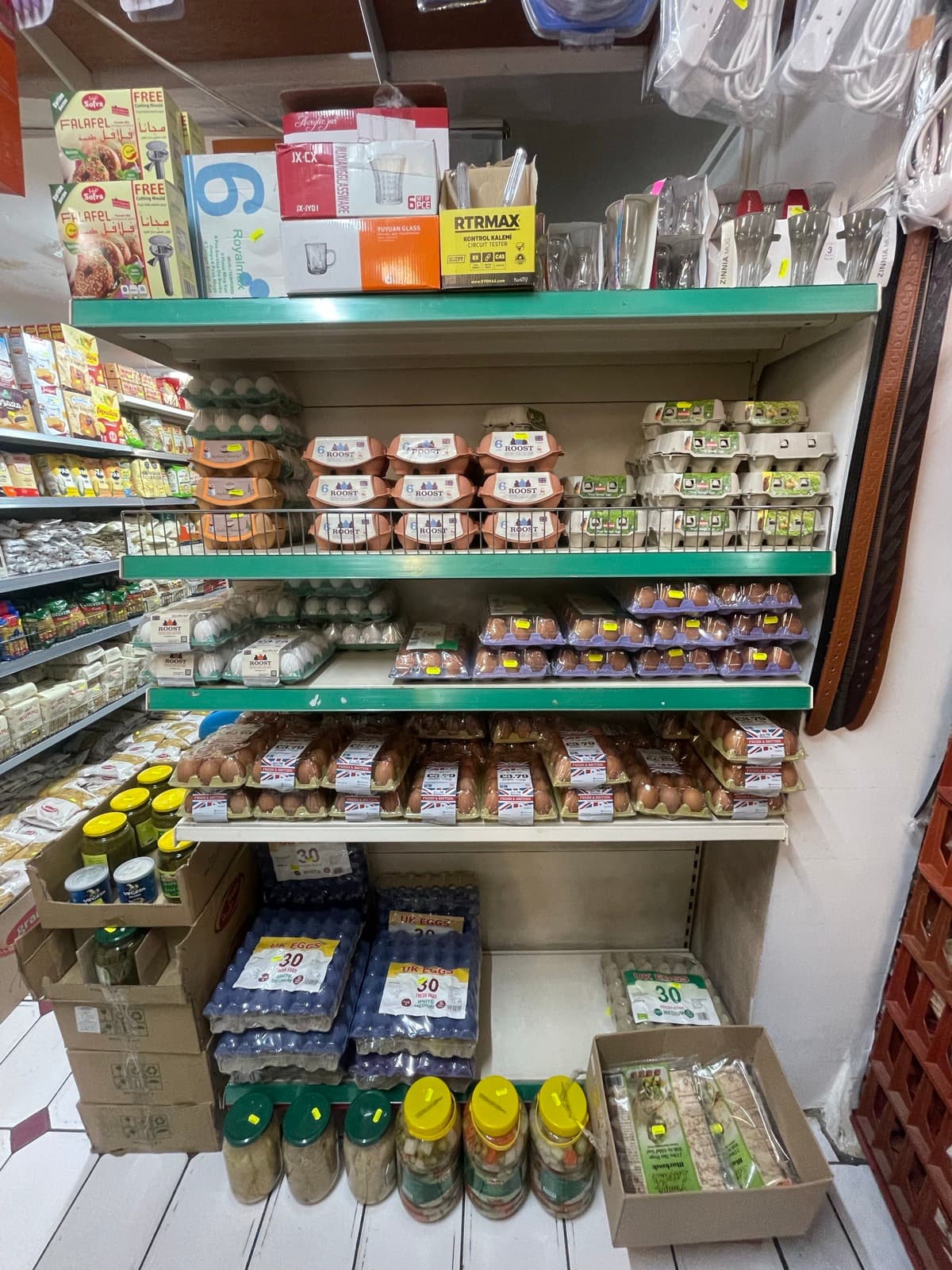 Fridge shelves of yoghurt, milk and cheese