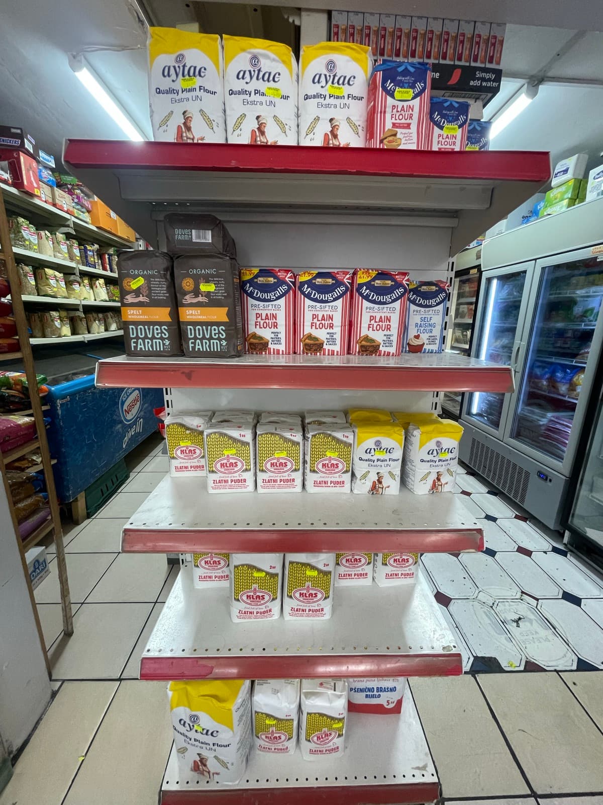 Shelves of flour bags and baking essentials