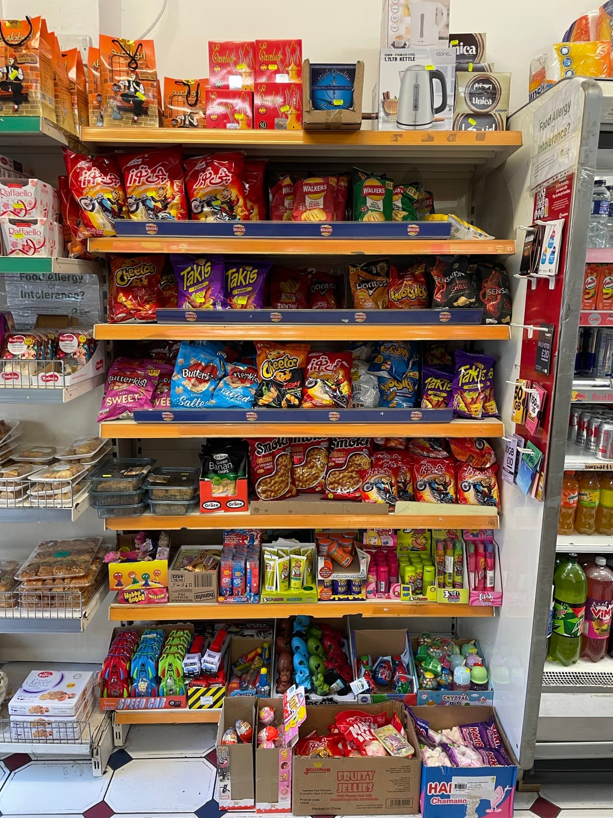 Shelves of crisps and packaged snacks